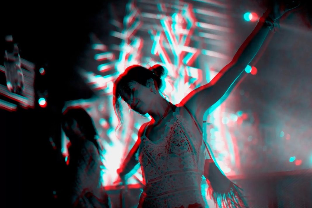 woman-dancing-in-a-music-festival-in-double-color-exposure-effect-1920x1281