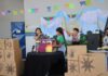 Crianças apresentam contação de histórias em Libras, com tradução para o português, em escola municipal